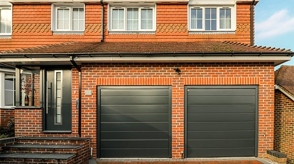 front entrance door and garage doors at Salisbury property